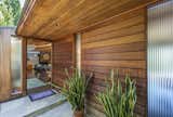 The home's serene, wooded entry.