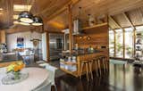 The open chef's kitchen offers a seamless flow to the living room and adjacent dining area. 