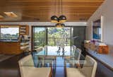 Sliding glass doors off the dining room create a seamless indoor-outdoor flow.