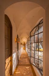 Airy breezeways and steel and glass windows infuse the living experience with the romance of the grounds that surround.