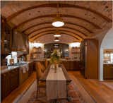 A two-story French country cottage with gorgeous barrel vault ceilings.