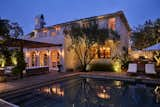 The newly updated swimming pool exudes a romantic glow at twilight. 