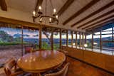 A glass-enclosed ding space opens to sweeping patios and extraordinary views.