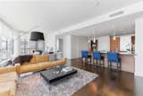 Interiors, with tall ceilings and hardwood floors, are bathed in natural light.