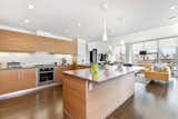 The contemporary kitchen with countertop seating and spectacular views. 