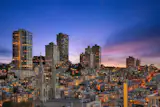 The city skyline captured from the rooftop terrace. 