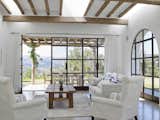Steel and glass doors foster a seamless indoor-outdoor flow to breathtaking outdoor spaces.