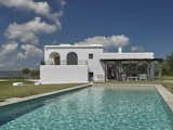 A sparkling swimming pool completes the experience. 