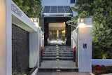 A dramatic entry welcomes residents and guests with a cascading waterfall