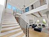 Staircase  Photo 14 of 18 in Modern Take on The Classic Farmhouse Style by Luxury Homes & Lifestyle