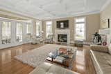 The family room is lined with windows to welcome in natural light from every angle. 