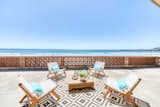 The property’s expansive private deck offers sweeping views of the Pacific Ocean with the famed Cayucos Pier and Morro Rock in the distance.