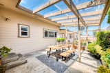 This quaint retreat includes a glass enclosed pergola offering an indoor/outdoor feel for optimal entertaining. 