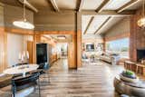 With vaulted beamed ceilings and a warm color palette, the home is a cozy oasis for those seeking a coastal lifestyle. 