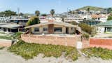 A midcentury modern, beachfront oasis awaits at this Cayucos home along the central coast of California.