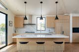 Spanning over 2,600 feet, this home masterfully blends glass, stone, wood, and other natural materials. 