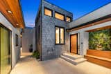 Featuring two structures and a separate Auxiliary Structure Unit (ASU), the 2,615 square-foot, four-bedroom, five-bathroom home is ideal as an investment property or as a live and work space. 