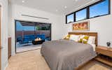 The second residence features two bedrooms and two bathrooms with artistic, porcelain tile Mojave Bella flooring and modern light fixtures throughout. 
