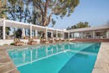 Boasting over 8,000 square feet, the property also has adjoining parcels totaling 14 acres for true privacy.