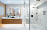 A handsome master bath with dual vanities, a soaking tub, and a spa shower.