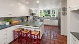The 4,177 square-foot home features a warm color palette throughout with sun-filled rooms and updated fixtures, finishes, and stainless steel appliances.