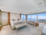 Bedroom Located on half an acre in one of the most prestigious gated communities in Oahu, the home’s breathtaking, panoramic views of the ocean and Diamond Head are visible from every corner of the property.  Photo 4 of 4 in High Fashion Home in Honolulu by Luxury Homes & Lifestyle
