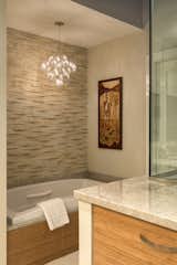 The Crystal Galaxy is a sleek, lightweight chandelier that adds a sense of radiance wherever it is placed