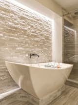 Light Channel Micro Grazer illuminates a serene atmosphere in this sophisticated bathroom
