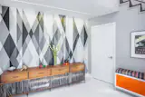 The Reveal Wall Wash adds a clean gleam of light to complement bold, graphic decor