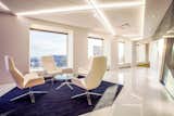 Softline Indirect LED Lighting System draws the eye and adds depth to this modern office space. 