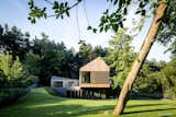 Valley Villa
Architectural firm Arches has recently created a contemporary, eco-friendly villa within close proximity to Vilnius, the capital of Lithuania and the country’s largest city. Clad in 7,000 sq. ft. of sustainable Kebony wood, this unique property has been built to complement the scenery, with natural timber cladding and irregular pitched roofs, characteristic of the neighbouring surroundings and in harmony with the hillsides and pine trees. The villa strikes the perfect balance with an architectural style that is simultaneously modern and traditional.
The clean, angular design creates a minimalist exterior with Kebony as the prime material contrasting against the black slate at the building’s base. Architect, Arūnas Liola, aimed to design a structure that is both ecologically friendly and striking in appearance, interweaving natural materials with a bold sculptural form. The firm has frequently chosen to work with Kebony due to the fact that it is a natural material but with the resistance to stand up to testing conditions far better than softwood. The quality of the wood, and through the skills of an exceptional carpenter, meant the timber could be sculpted and worked with easily for this particular project. Kebony requires no additional treatment even when used as an external cladding, the material simply develops a silver-grey patina which will allow the house to adapt naturally to its surroundings over a period of time.
The patented Kebony technology is an environmentally friendly process, which modifies sustainably sourced softwoods by heating the wood with furfuryl alcohol - an agricultural by-product. By polymerizing the wood’s cell wall, the softwoods permanently take on the attributes of tropical hardwood including high durability, hardness and dimensional stability, without the need for tropical deforestation, resulting in a high performing, beautiful wood product.