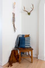 Mia Patchwork Pillow handcrafted with reclaimed denim and vintage African textiles.  Also featured our Freja Fringe Tote in color Saddle