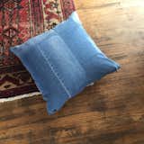 Our Cleo Upcycled Denim Pillow is patchworked with love.
