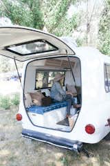 Designer and Stylist Amber Seagraves inside Little White Camper, a pop up Airbnb located in Idyllwild, CA