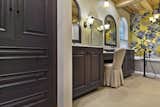 Wood-Mode linen cabinet and matching Wood-Mode vanities with custom mirror frames