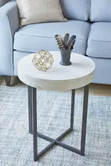 Bird feathers from a friend's farm in the Hudson Valley are the right accent for a masculine Wedgewood basaltware cup.