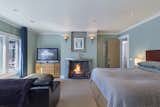 Master Bedroom features a metal fireplace surround fabricated by artist Susie Wibroe.