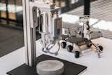 Unlikely bedfellows; a high-powered microscope and model rover display on the 2nd floor.