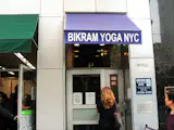 A Bikram Yoga studio...right next to a 7 Eleven on the corner of the W 23rd St's thoroughfare and 5th Ave. 