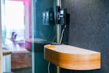 Soundproofed phone booths allow for privacy on calls. 
