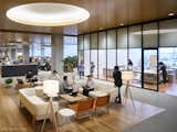 Work studios and comfy lounges adjoin spacious bullpens in Uniqlo City.
