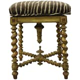 Available on viyet.com!

This antique piano bench is small in stature but grandiose in design. Its gold-colored legs are sculpted in elegant spirals and the plush seat is upholstered in a zebra-print fabric that gives it a contemporary touch.

https://viyet.com/antique-small-piano-bench-sea-20066-9588.html
