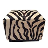 Available on viyet.com!

The Ralph Lauren name is synonymous with a classic American traditional furniture style. From Lauren's Modern Hollywood collection comes this striking ottoman, which is covered in a hide in a bold zebra print which brings forward a vintage furniture style. The dark stained wood plinth base provides modern support.

https://viyet.com/modern-hollywood-zebra-ottoman.html
