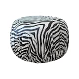Available on viyet.com!

This eye-catching pouf ottoman was curated by Los Angeles designer Gina Berschneider, who is known for her exquisite furniture designs (which are made in Southern California). The piece has a classic pouf silhouette with a gathered side, a detail that's enhanced by the striking zebra print hide upholstery by Edelman.

https://viyet.com/hattie-ottoman.html
