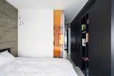 the bedroom & a view to the shower through a corner dichroic glass