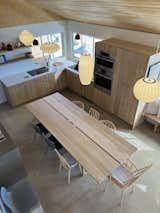 KITCHEN / DINING - The all custom white oak electric kitchen is designed around a custom 12 seat chef’s table so meals can be less formal and more communal.