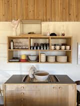 Kitchen, Laminate Counter, Open Cabinet, Light Hardwood Floor, Brick Backsplashe, Wood Cabinet, and Plywood Floor  Photo 9 of 19 in Hoot Owl Ranch by Jared Eberhardt