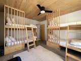 Bedroom, Bed, Concrete Floor, Ceiling Lighting, and Bunks BEDROOM 3 - Bunkhouse for up to four.  Photo 11 of 19 in Hoot Owl Ranch by Jared Eberhardt