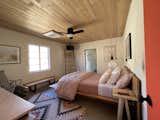 Bedroom, Chair, Ceiling Lighting, Bed, Night Stands, and Concrete Floor BEDROOM 2 - Queen Bed  Photo 12 of 19 in Hoot Owl Ranch by Jared Eberhardt