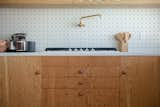 Kitchen, Cooktops, Wood Cabinet, Engineered Quartz Counter, Range, and Concrete Floor Kitchen   Photo 12 of 14 in Krisel's Glass Cabin by Jared Eberhardt